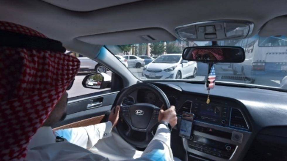 Hussein starts his day's work for ride-hailing service Uber in the Saudi capital Riyadh. 