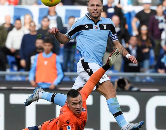 Lazio moved top of Serie A on Saturday with a 2-0 victory over Bologna as five matches were postponed in the Italian top flight due to fears over the coronavirus.