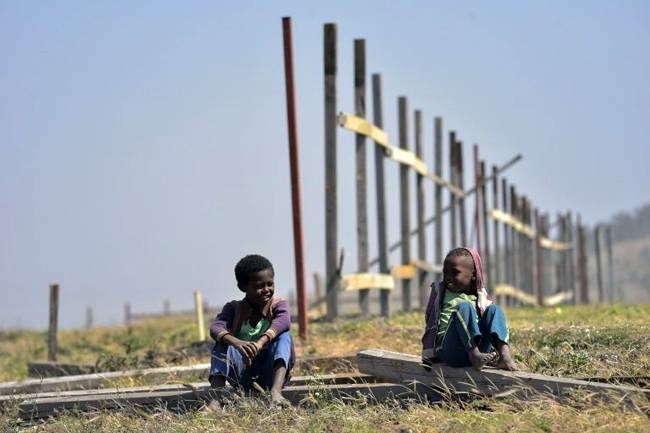 A year later, the crash site of Ethiopian Airlines Flight 302 is surrounded by an unfinished wooden fence. — AFP 
