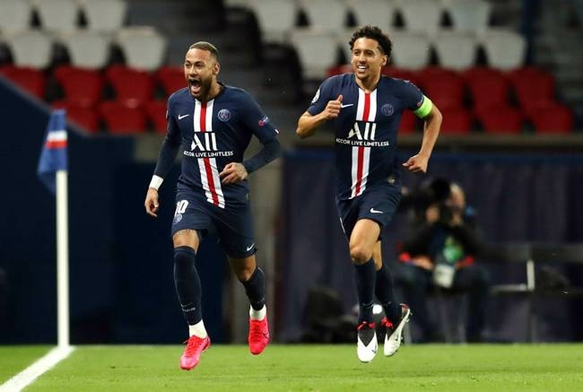 Neymar celebrates putting PSG ahead against Borussia Dortmund as captain Marquinhos gives chase. — AFP