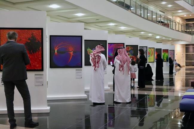 Visitors at the Max Planck Images of Science exhibition at Al Faisal University.