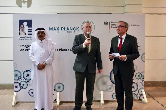 Visitors at the Max Planck Images of Science exhibition at Al Faisal University.