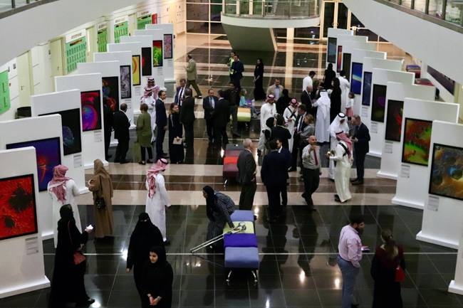 Visitors at the Max Planck Images of Science exhibition at Al Faisal University.