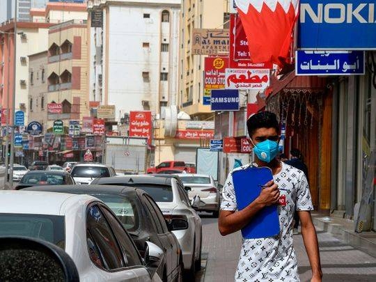 A man wearing a surgical mask is pictured in the heart of the Bahraini capital Manama in this file picture. — Courtesy photo