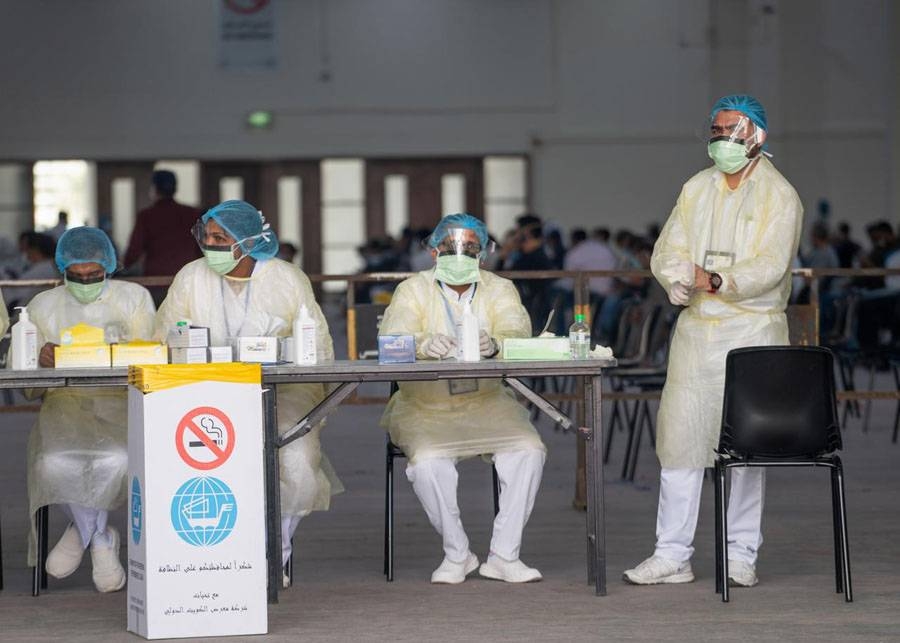 Nurses are seen at a makeshift coronavirus testing center for expatriates at the Mishref Fair Grounds in Kuwait city, Kuwait, in this March 12, 2020 file picture. — Courtesy photo
