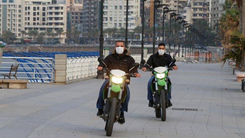 Police members wear face masks as they ride on motorbikes at Beirut's seaside Corniche as Lebanon declared a medical state of emergency on Sunday as part of the preventive measures against the spread of the coronavirus. ‑ Courtesy photo