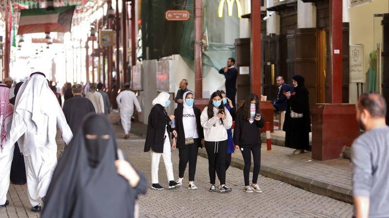 Kuwaiti women wear protective masks at the Mubarakiya Market in Kuwait City in this file picture. — Courtesy photo