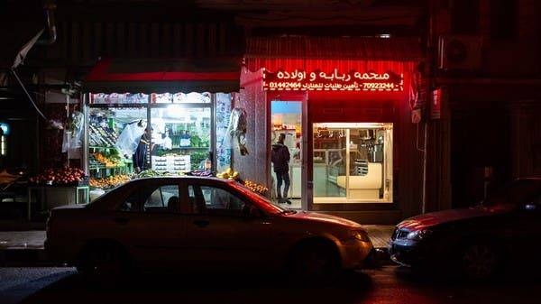 In the normally bustling Mar Mikhael neighborhood of Beirut, a fruit seller keeps his doors open while a butcher prepares to shut down his shop. ‑‑ Courtsey photo