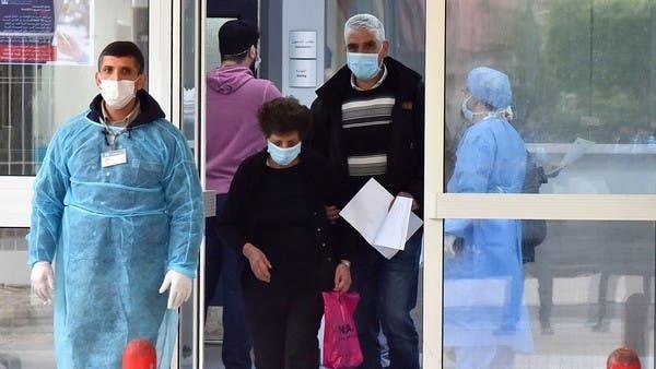 People exit the emergency section at Rafiq Hariri University Hospital in Beirut where coronavirus patients are being treated. -- Courtesy photo