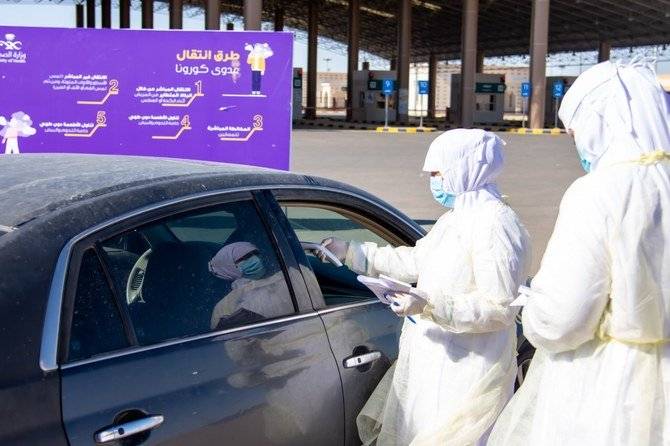 Saudi medical staff carry out tests on people entering Saudi Arabia via a land border. — Saudi Health Ministry
