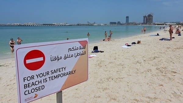 People take a sunbath along the Jumeirah Beach residence in Dubai on Monday despite its closure by authorities amid the COVID-19 coronavirus pandemic. -- Courtesy photo