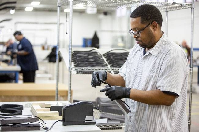 Operators and assemblers assemble medical face shields. Ford Motor Company, in cooperation with the UAW, will assemble more than 100,000 critically needed plastic face shields per week at a Ford manufacturing site to help medical professionals, factory workers and store clerks. 
