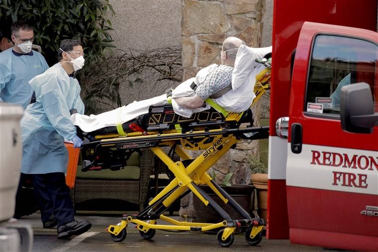A nursing home worker and a medic are seen at the Life Care Center of Kirkland in Washington in this March 7, 202 file picture. — Courtesy photo