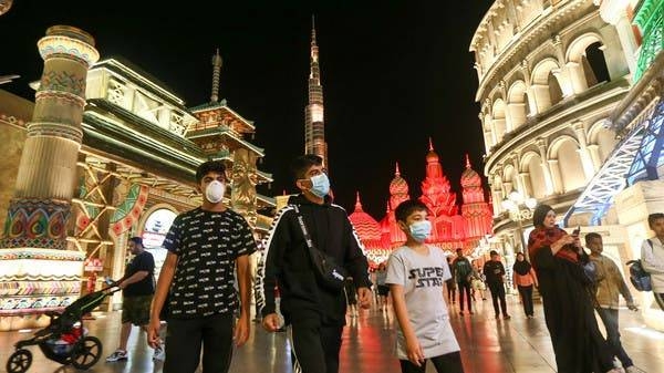 People wear protective masks, following an outbreak of coronavirus, as they walk at Global Village in Dubai in this file picture. — Courtesy photo
