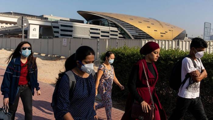 Commuters wear face masks outside a metro station in downtown Dubai in this file picture. — Courtesy Bloomberg