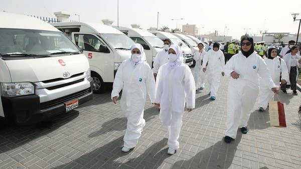 A team of doctors and nurses prepare themselves before heading out to their designated residential areas to check on residents who returned from Iran if anyone is infected with the novel coronavirus, at Isa Town Health Center, south of Manama, Bahrain. -- Courtesy photo