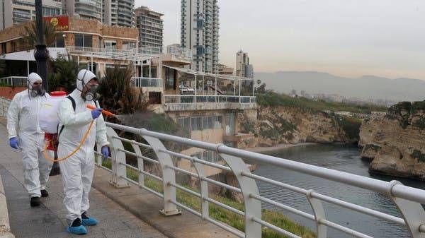 Employees from a disinfection company sanitize handrails as a precaution against the spread of the coronavirus at Beirut's seaside Corniche, Lebanon. -- Courtesy photo