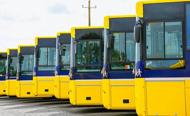 A view of European buses at a standstill.
