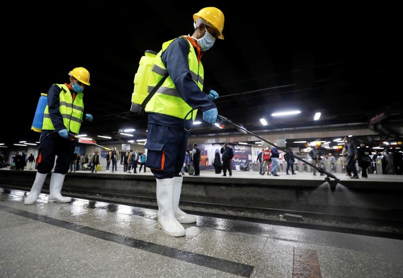 A member of medical team sprays disinfectant as a precautionary move amid concerns over the coronavirus disease (COVID-19) outbreak at the underground Al Shohadaa Martyrs metro station in Cairo. -- Courtesy photo