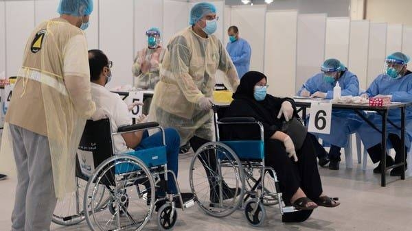 Volunteers help Kuwaitis, arriving from Europe, to do their compulsory testing at a coronavirus testing center, at the Kuwait International Fairgrounds in Mishref. -- Courtesy photo