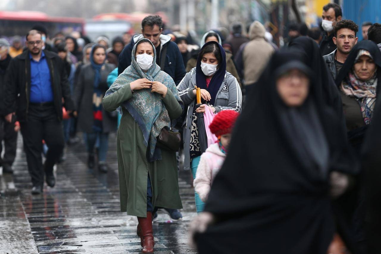 Iranian women wear protective masks as they walk at Grand Bazaar in Tehran in this picture. — Courtesy photo