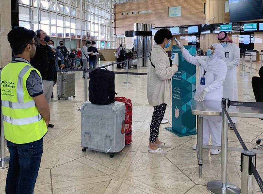 Koreans are screened before boarding the special Saudia flight to Korea.