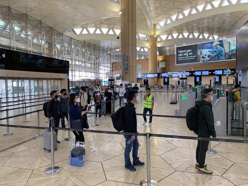 Koreans are screened before boarding the special Saudia flight to Korea.