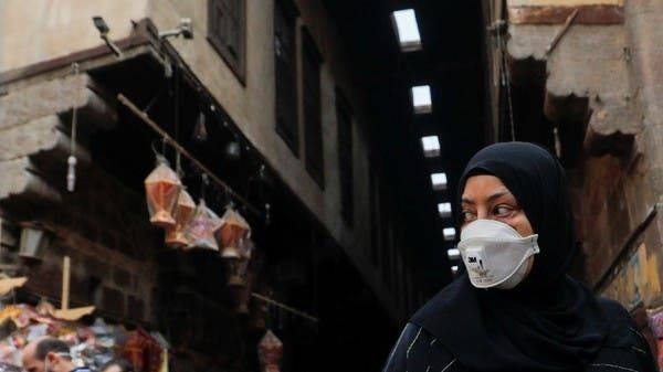 A woman wearing a protective face mask looks at traditional Ramadan lanterns ahead of the Muslim holy month of Ramadan at Al Khayamia Street in old Cairo. -- Courtesy photo
