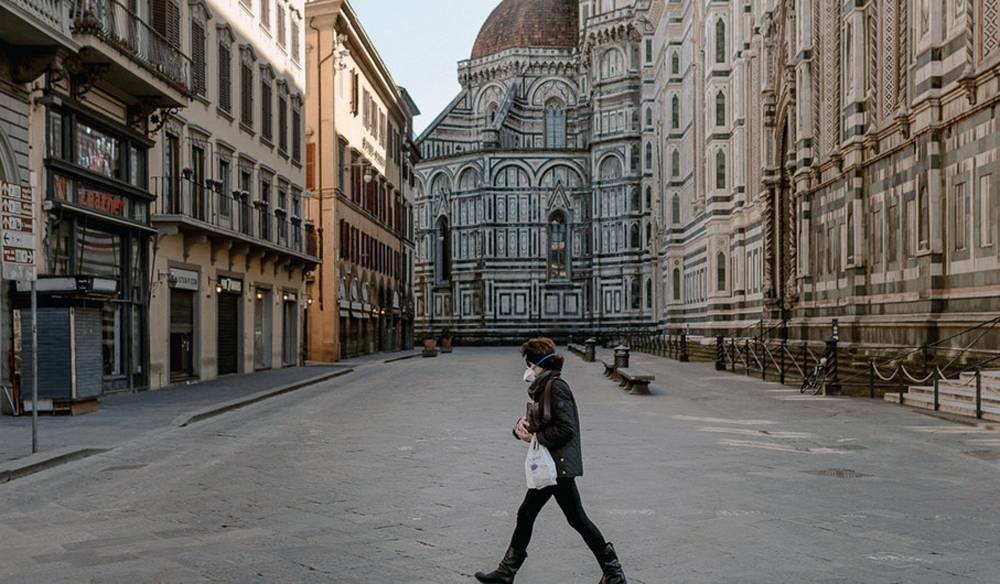 A lone pedestrian in Piazza Del Duomo, a space normally crowded with thousands of visitors. — UN courtesy photo by Francesco Spighi (www.francescospighi.com)