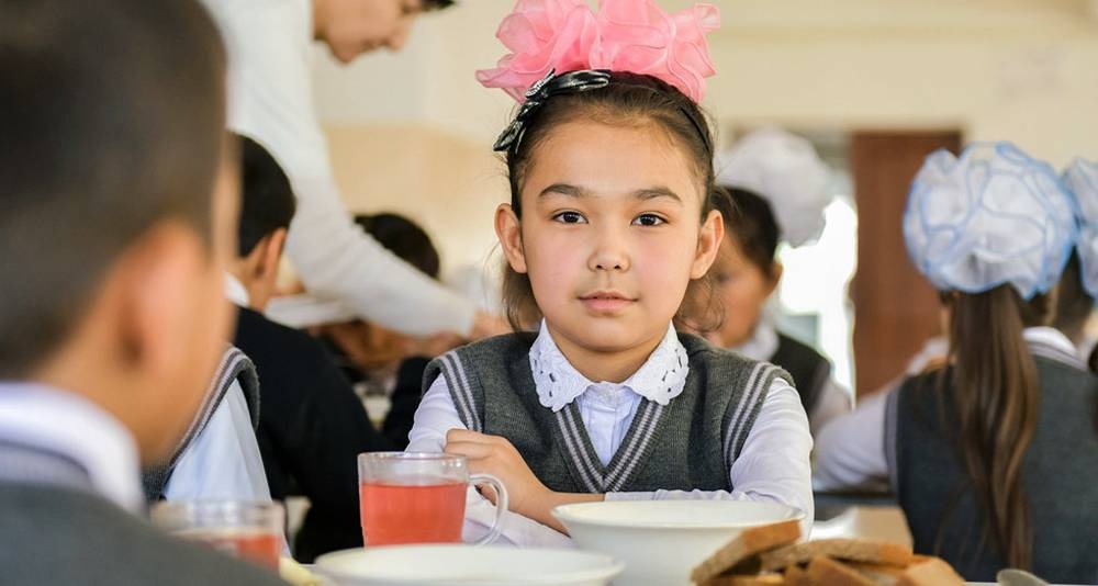 A 9-year-old girl eats lunch at a primary school in Turkestan city, Kazakhstan. — courtesy photo