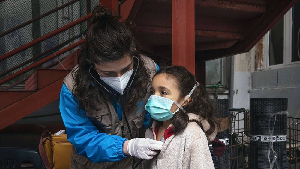 A seven-year-old receives a medical screening from Dr. Antonella Tochiaro in an informal settlement where she lives in Rome, one of millions of children during the pandemic who are out of school. — courtesy photo