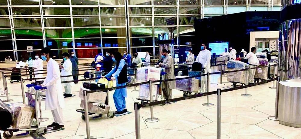 Pakistan Ambassador Raja Ali Ejaz speaks to  passengers before the PIA flight departure to Islamabad.