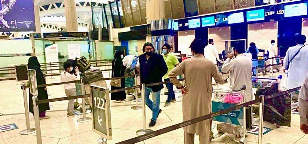 Pakistan Ambassador Raja Ali Ejaz speaks to  passengers before the PIA flight departure to Islamabad.