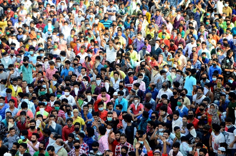 Migrant workers wait to board a special train to return to Agra in Uttar Pradesh state, at a railway station in Ahmedabad, Gujarat -- Courtesy photos

