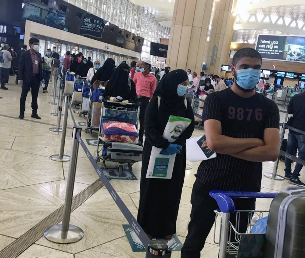 Passengers seated in the Air India flight operated to repatriate Indians from Riyadh to Calicut on Friday.