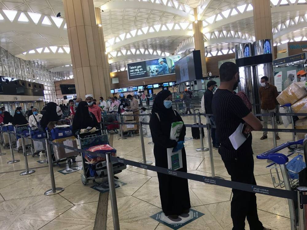 Passengers seated in the Air India flight operated to repatriate Indians from Riyadh to Calicut on Friday.