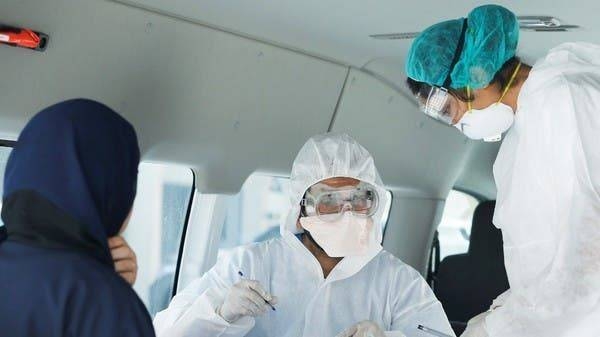 Doctors check a woman for coronavirus at Isa Town Health Center in Bahrain in this file picture. — Courtesy photo