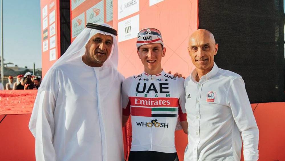 L – R: Matar Suhail Al Yabhouni Al Dhaheri (president), Tadej Pogačar, Mauro Gianetti (team principal & CEO). — courtesy photo