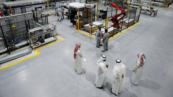 Workers are seen at the solar plant factory in Uyayna, north of Riyadh. — Courtesy photo