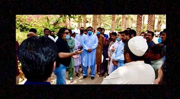Pakistani Ambassador Raja Ali Ejaz with a group of Pakistanis who will be leaving for Lahore on Thursday. -- Courtesy photo