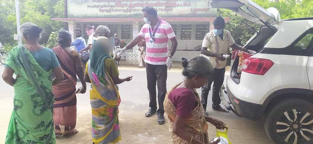 Tamil society members reach out to the poor back home