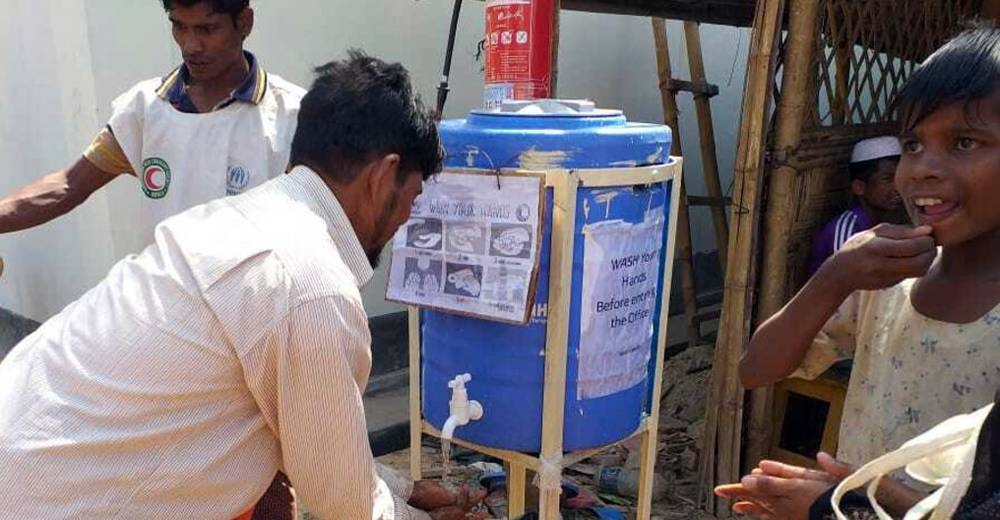 
Rohingya refugees use a handwashing station, installed to help combat the spread of COVID-19 at a settlement in Cox's Bazar, Bangladesh. – courtesy photo UNHCR