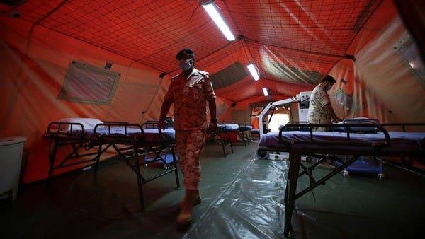 Bahrain Defense Force medical staff wearing protective face masks are seen at a makeshift ICU 