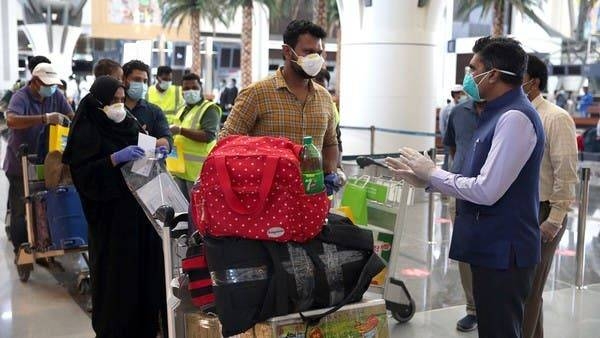Indian nationals check in at the Muscat International Airport before leaving the Omani capital on a flight to return to their country. -- Courtesy photo
