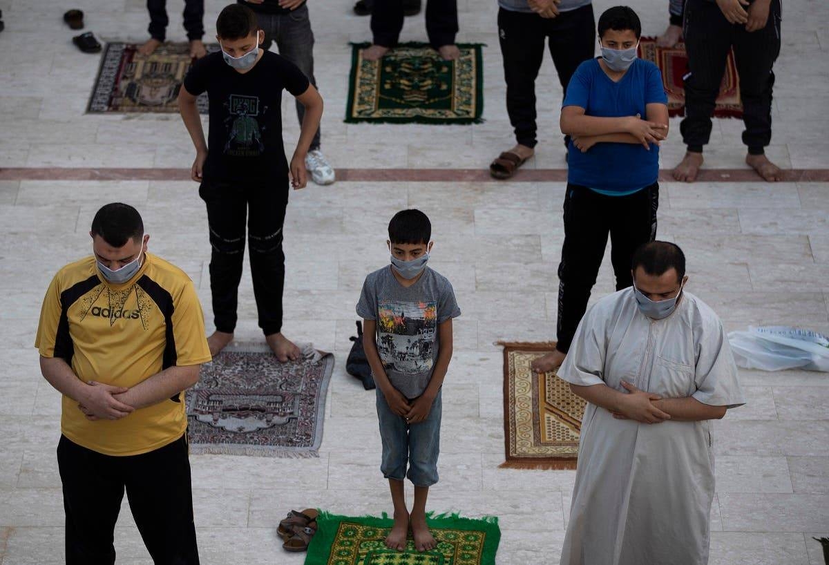 Muslims wearing face masks attend the Eid Al-Fitr prayers outside a mosque in Gaza City on Sunday. — Courtesy photo