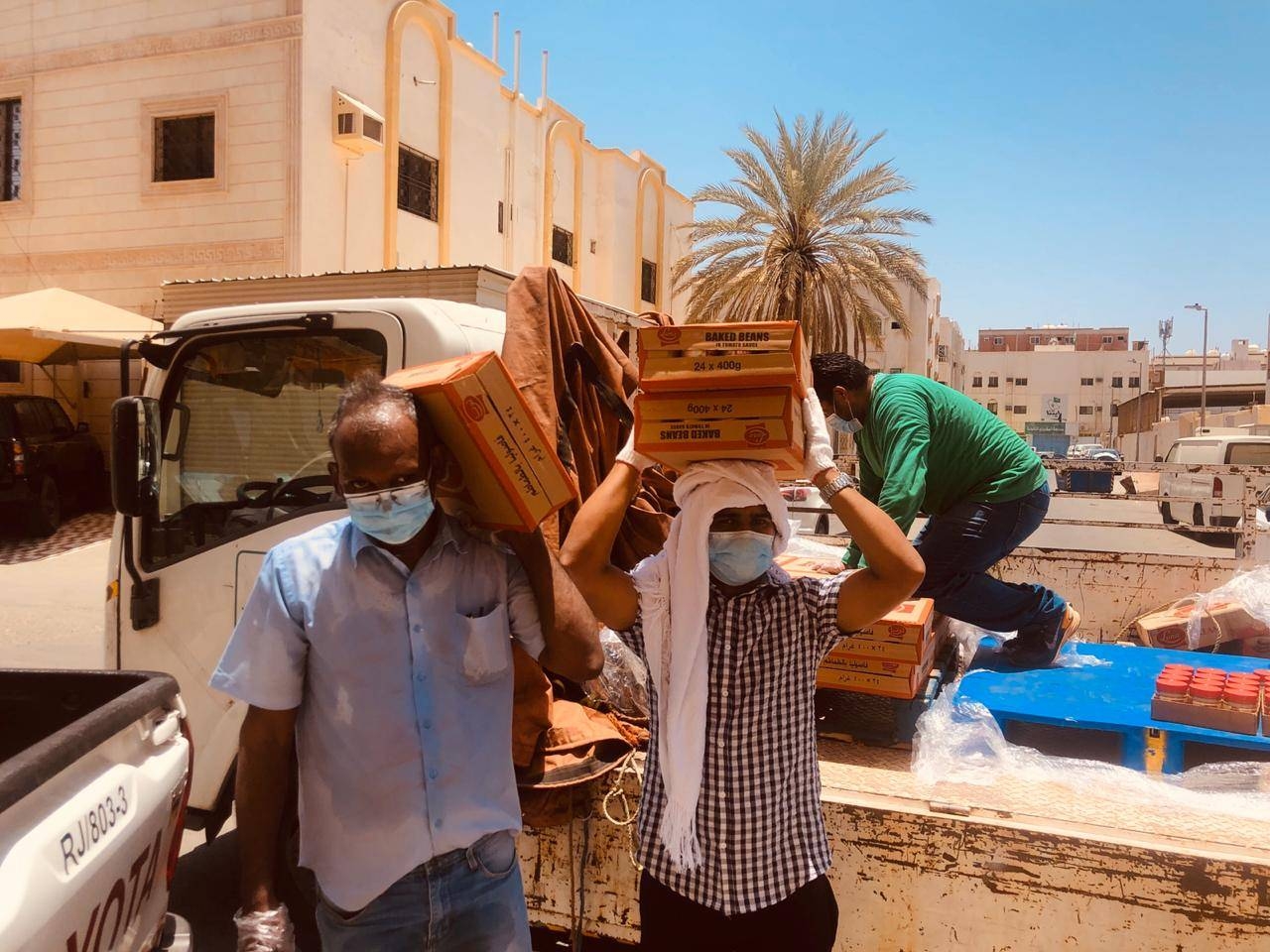 KMCC volunteers are seen distributing PPE kits to passengers bound for India at King Abdulaziz International Airport in Jeddah.