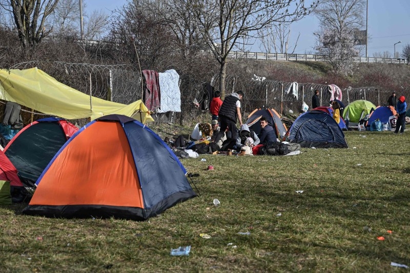 People are seen at a migrants' makeshift camp near a bus terminal, as they wait to resume their efforts to enter Europe near Pazarkule border gate in the city of Edirne, northwest Turkey, in this file picture. — Courtesy photo