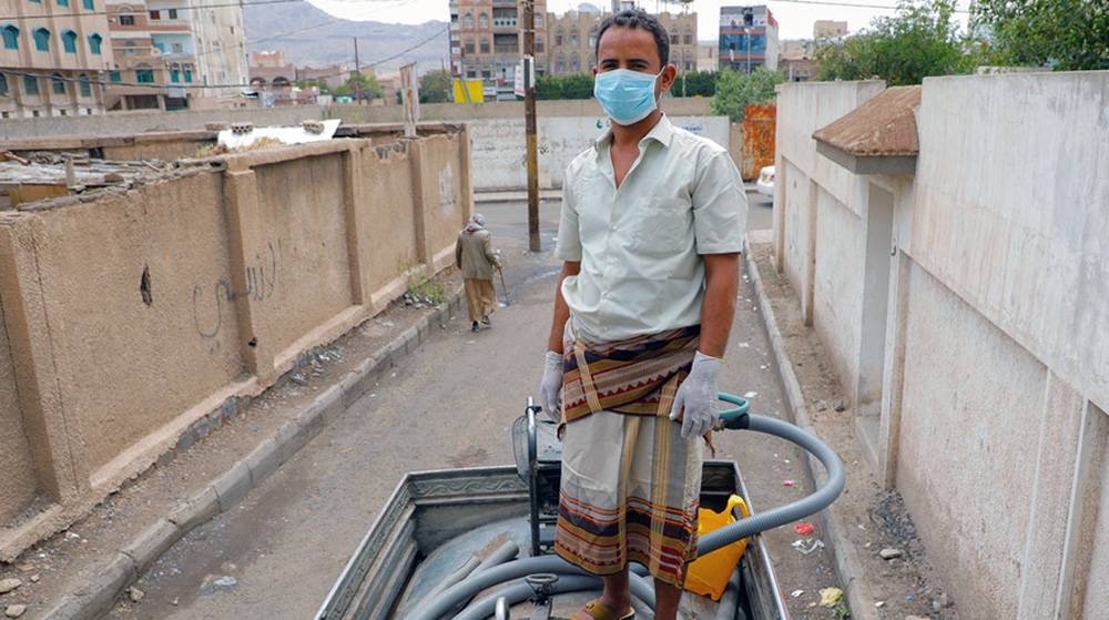 A man works on a water truck delivering water to communities in Sana'a, Yemen, where UNICEF is providing families with access to clean water during the COVID-19 pandemic. — courtesy photo UNICEF/Moohialdin Fuad
