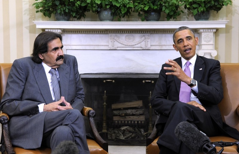 Ex-US President Barack Obama meets with the emir of Qatar, Hamad bin Khalifa Al Thani, in the Oval Office on April 26, 2013. — AFP