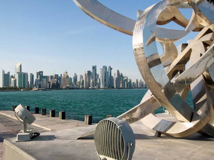 Buildings are seen from across the water in Doha. -- File photo
